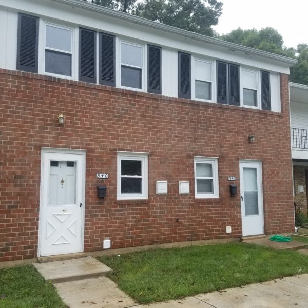 Maryland Pro Wash offers premier pressure washing services, perfect for revitalizing a two-story brick building with white trim. Imagine the transformation as layers of dirt and grime are washed away from the façade, making those two front doors and numerous windows with black shutters gleam like new. Whether you're in Harford County MD or stretching to Wilmington DE, Maryland Pro Wash ensures every detail shines brightly—including house numbers and mailboxes gleaming against the clean backdrop. Encircled by neatly trimmed grass and framed by pristine trees in the background, your property will stand out with renewed charm, thanks to their expert service throughout Baltimore County MD, Cecil County MD, Howard County MD, Carroll County MD, Anne Arundel County MD, New Castle County DE, and Delaware County PA.