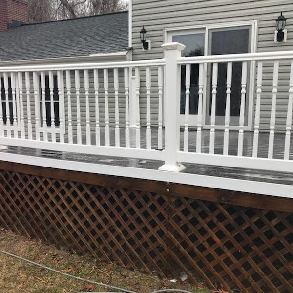 Maryland Pro Wash specializes in transforming outdoor spaces with expert pressure washing services throughout the region. Imagine a white wooden deck, complete with railing, stretching gracefully from a house adorned with elegant beige siding. This elevated deck is accented by brown latticework beneath it, adding both charm and function to the structure. Now picture this deck revitalized and spotless after a thorough cleaning by Maryland Pro Wash. Our professional team operates across Harford County MD, Baltimore County MD, Cecil County MD, Howard County MD, Carroll County MD, Anne Arundel County MD as well as Wilmington DE, New Castle County DE, and Delaware County PA. Whether it's removing dirt from decks or refreshing siding to its original glow—or even helping manage overgrown elements like garden hoses that rest on your lush green lawns—we are here to elevate your home’s exterior appeal through meticulous pressure washing services tailored just for you!