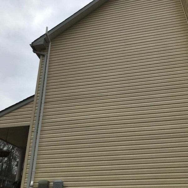 The image beautifully captures the exterior of a home with beige siding, complemented by a downspout and an overcast sky, setting an ideal backdrop for Maryland Pro Wash's services. Specializing in expert pressure washing, Maryland Pro Wash serves a wide range of areas including Harford County MD, Baltimore County MD, Cecil County MD, Howard County MD, Carroll County MD, Anne Arundel County MD, as well as Wilmington DE and New Castle County DE. They also extend their services to Delaware County PA. Whether you're looking to refresh your home's exterior or maintain its pristine condition through professional cleaning methods like pressure washing or soft washing especially for delicate siding materials. Maryland Pro Wash is dedicated to enhancing curb appeal while ensuring the longevity of your property across these regions.
