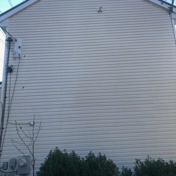 If you're looking to enhance the appearance of a house like the one described, Maryland Pro Wash is a top choice for professional pressure washing services. Specializing in revitalizing exteriors, they serve Harford County, Baltimore County, Cecil County, Howard County, Carroll County, Anne Arundel County in Maryland; Wilmington and New Castle County in Delaware; as well as Delaware County in Pennsylvania. Their expert team can handle tough stains on vinyl siding and ensure your home looks its best by carefully cleaning around utility boxes and satellite dishes while preserving surrounding greenery.

For residents of these areas looking to refresh their home's exterior with precision and care, Maryland Pro Wash offers reliable services that cover all those needs effectively.
