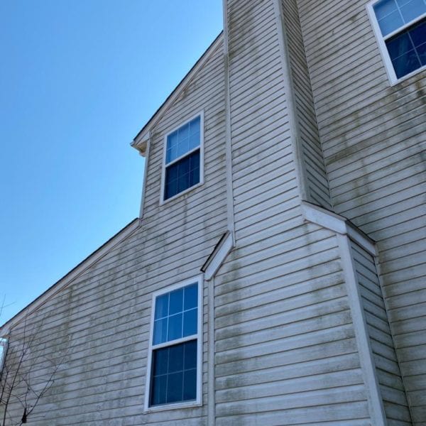 If you're looking for professional pressure washing services to restore the beauty of your home's exterior, Maryland Pro Wash is here to help. Specializing in tackling tough mildew and moss stains like those on your weathered beige house with vinyl siding, we offer expert pressure washing across several areas including Harford County MD, Baltimore County MD, Cecil County MD, Howard County MD, Carroll County MD, Anne Arundel County MD, Wilmington DE, New Castle County DE, and Delaware County PA. With the sunny skies as our canvas and a commitment to revitalizing your property's appearance, Maryland Pro Wash ensures results that leave your home looking fresh and pristine.