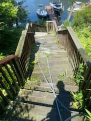 Deck before pressure washing by Maryland Pro Wash, showing dirt, grime, and weathered wood
