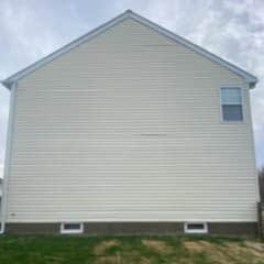 All white House siding after expert pressure washing by Maryland Pro Wash, restored to clean and vibrant condition