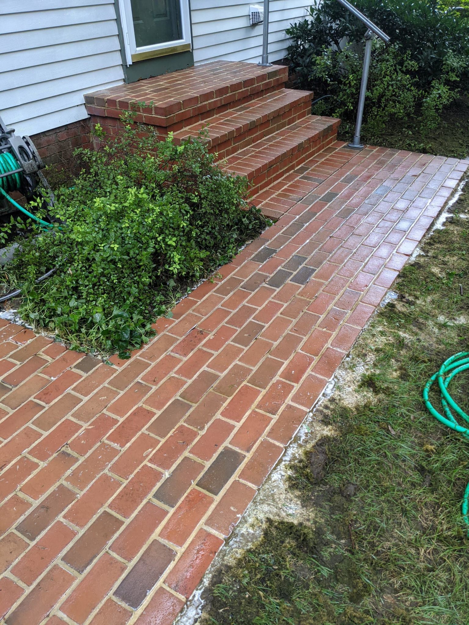 Completely Cleaned Red brick Patio after Professional Pressure Washing by Maryland Pro Wash, With all Dirt and Stains Removed