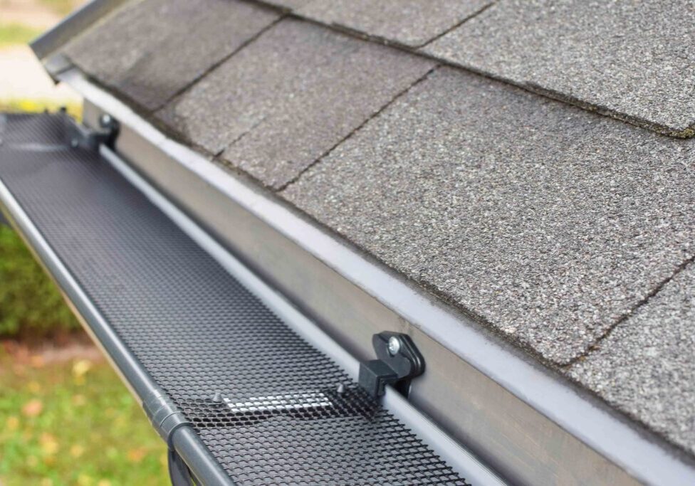 Showing Roof and Installation of a Gutter Guard on a Residential House By Maryland Pro Wash 