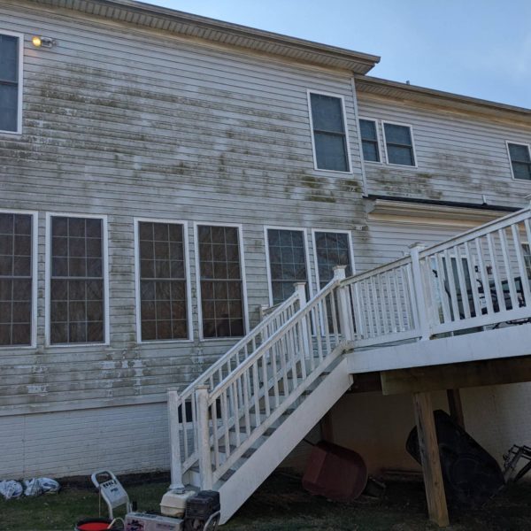 Before House Siding Cleaned by Maryland Pro Wash, Highlighting the Removal of Grime and Improved Curb Appeal